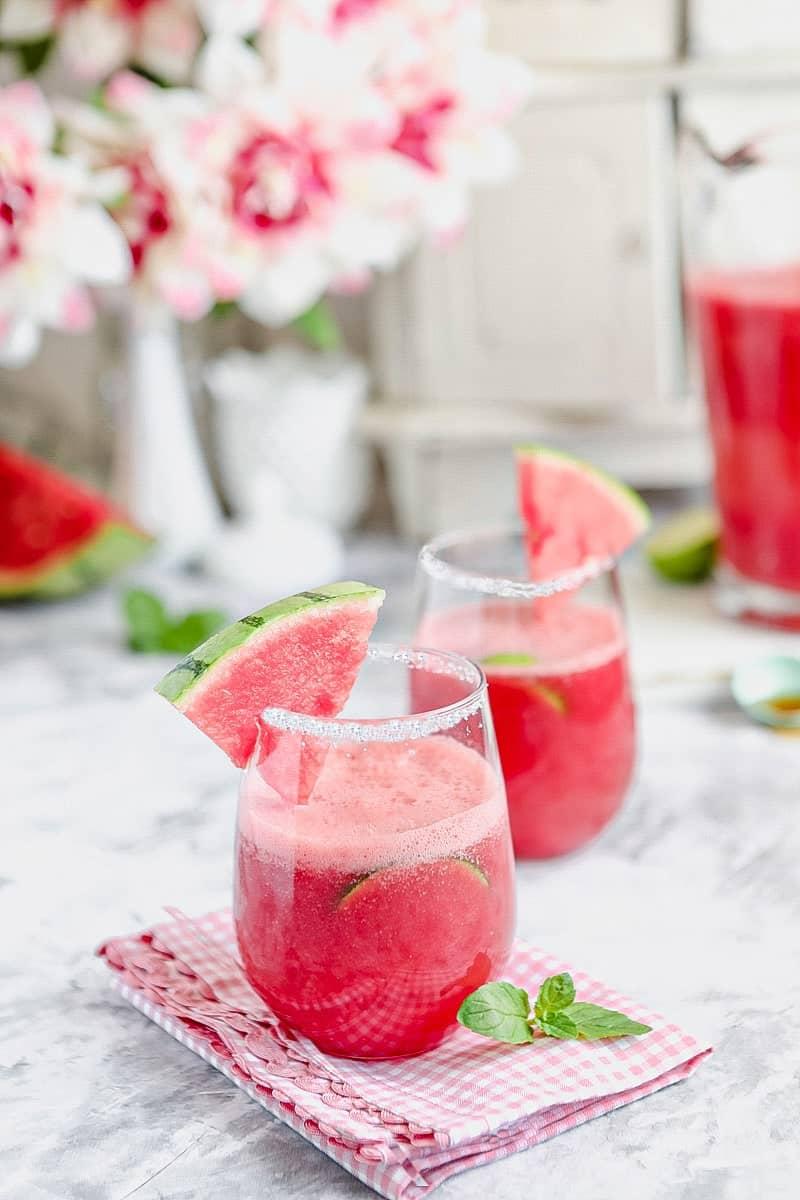 Refreshing watermelon refresher smoothie in a glass with mint garnish