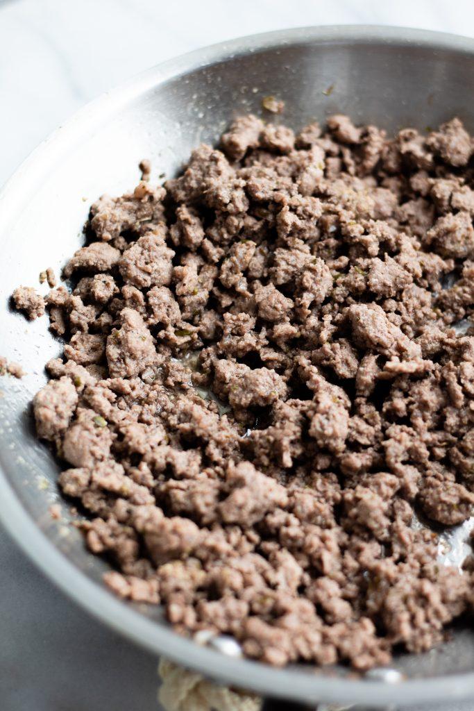 Ground lamb mixture being prepared in a bowl