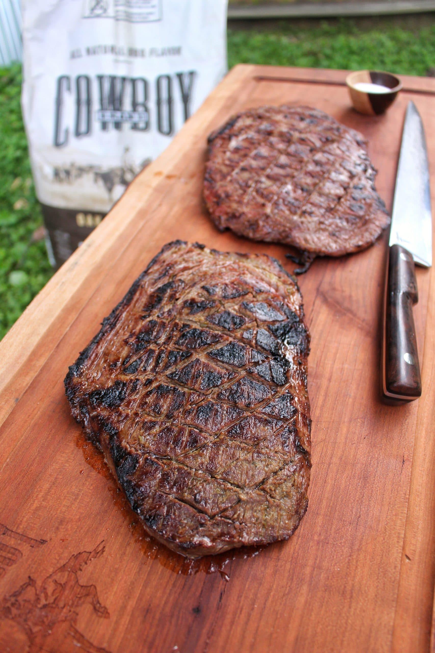 Close up shot of marinated carne asada on a grill