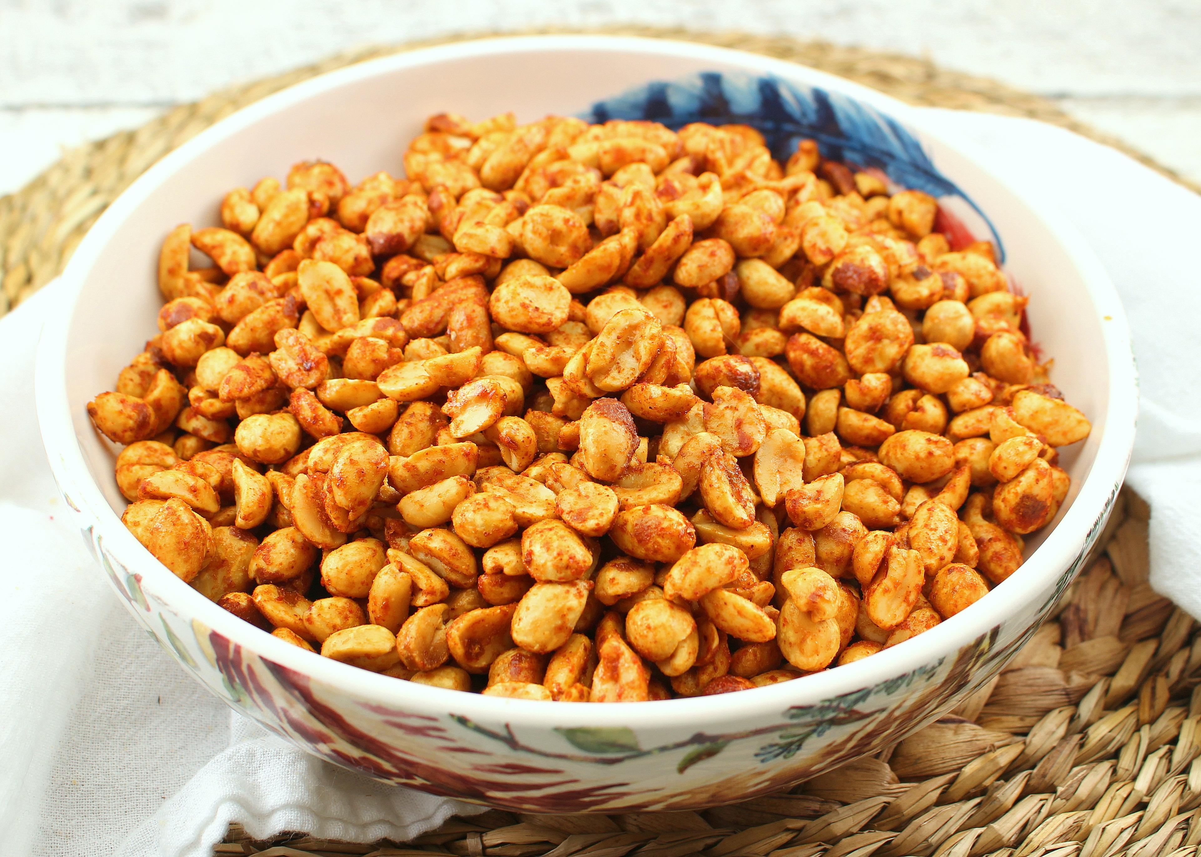 Close-up shot of honey-sriracha roasted peanuts in a bowl