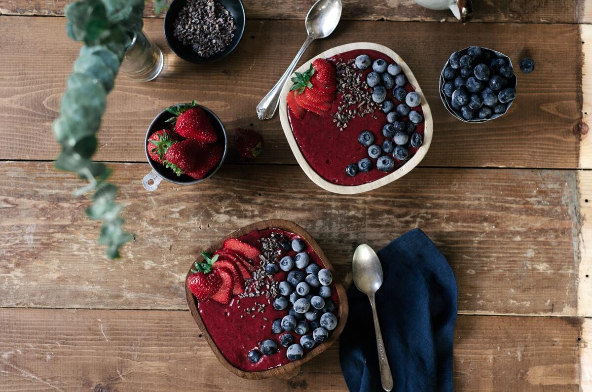 Close-up shot of a Paleo Berry & Yogurt Bowl, showcasing the vibrant colors and textures of the ingredients.
