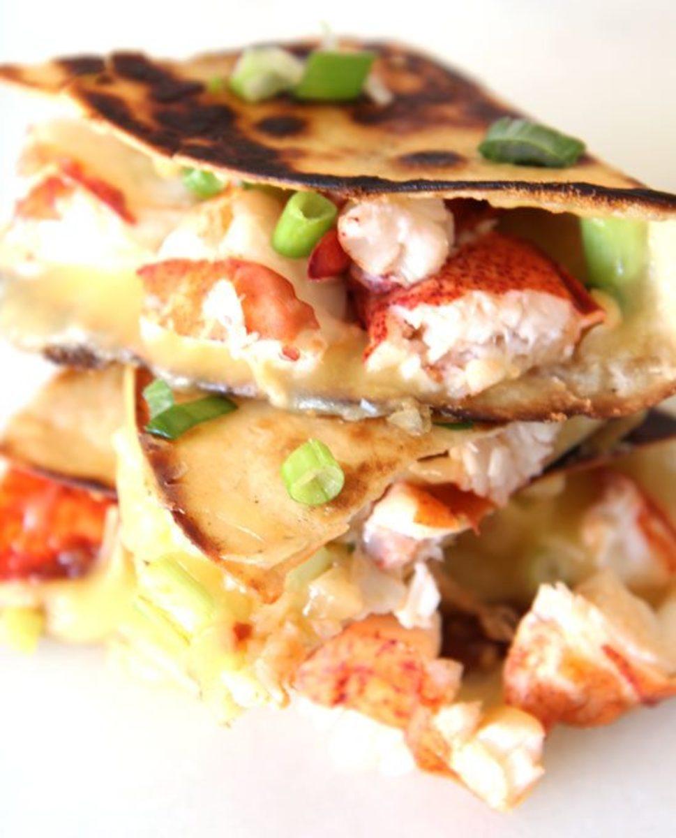 A close up of the melted manchego cheese inside the lobster quesadilla.