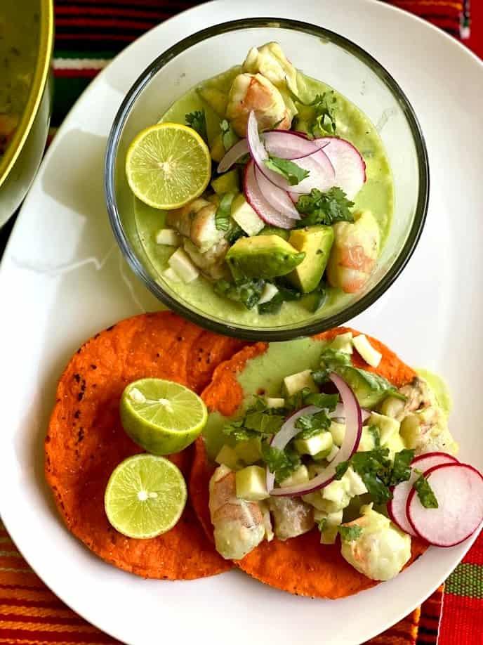 close-up of coconut lime shrimp ceviche being mixed in a bowl