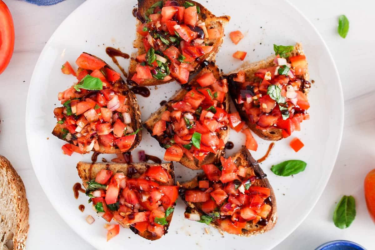barley and tomato bruschetta with fresh basil garnish