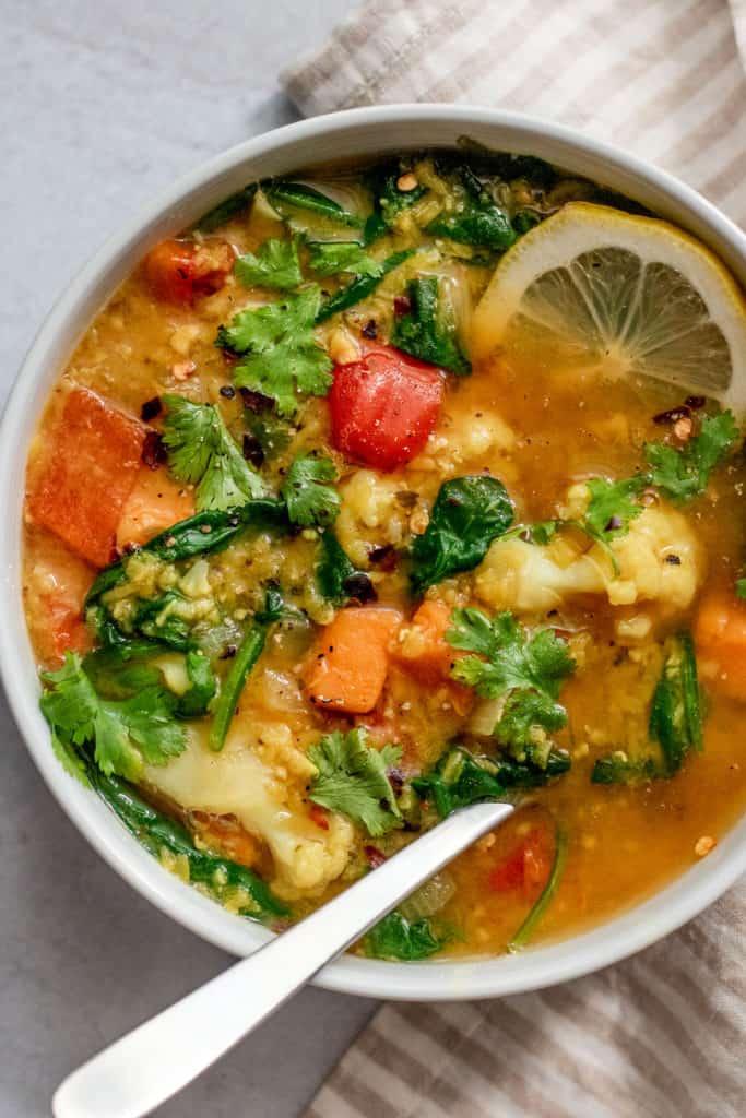 Close-up shot of a bowl of lentil soup with sweet potatoes