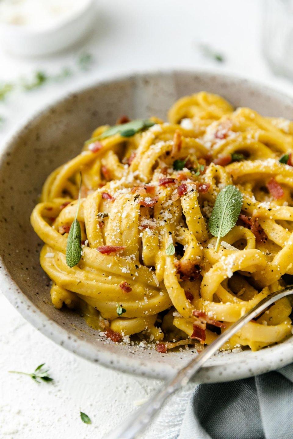 Butternut squash pasta with pancetta and parmesan cheese, close up shot