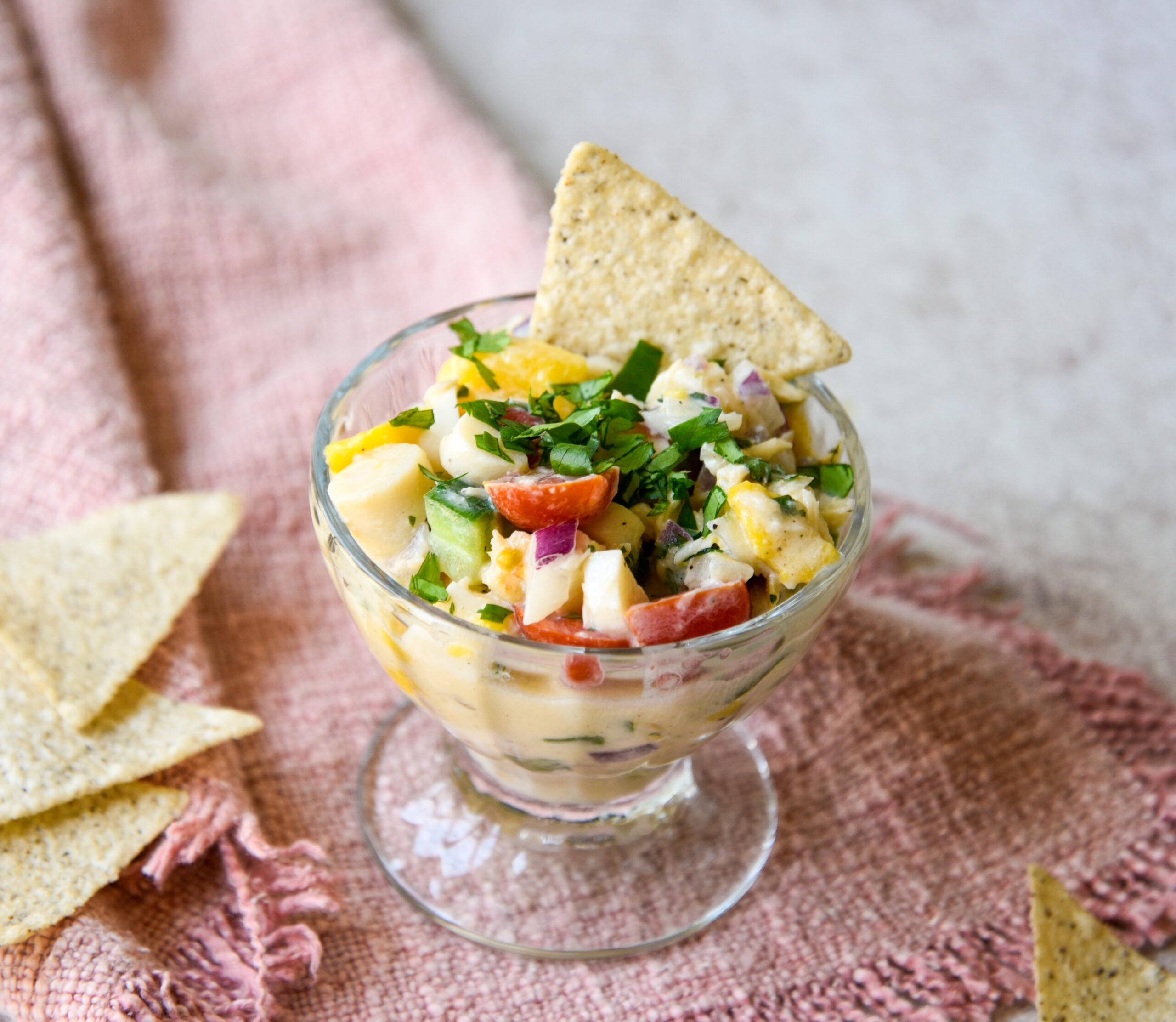 overhead shot of mango ceviche with coconut milk being prepared