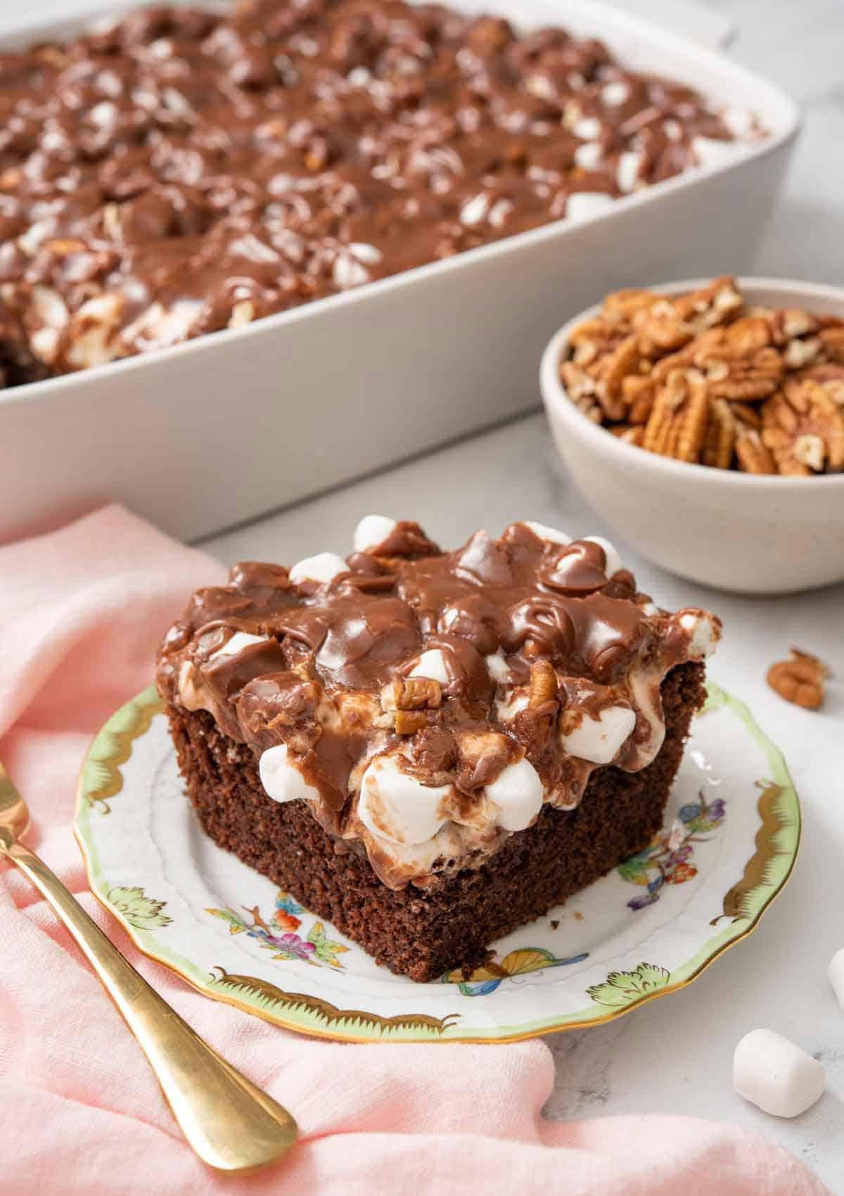 A warm, freshly baked Mississippi Mud Cake with chocolate frosting, showing the texture