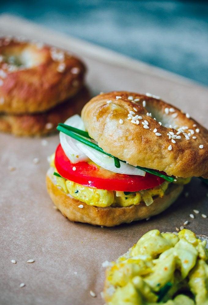 A delicious curried chicken salad bagel, ready to eat