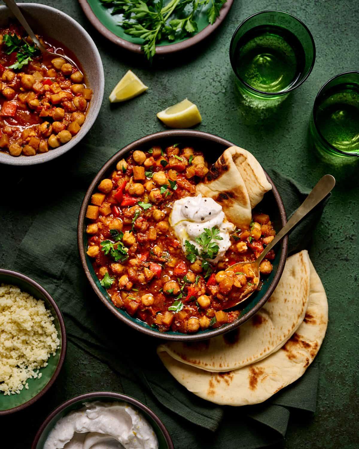 Close-up shot of the ingredients for the tagine, arranged beautifully on a wooden surface