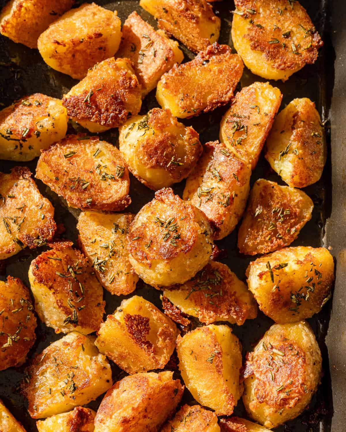 A close-up shot highlighting the crispy texture and golden brown color of the roasted potatoes.