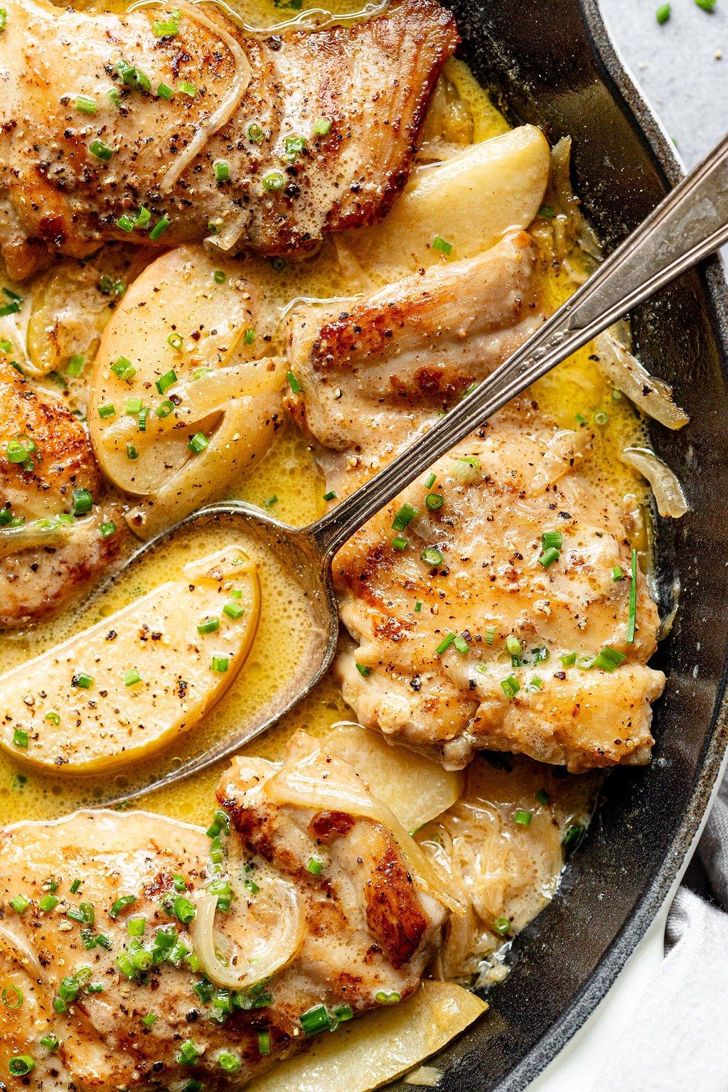 close up shot of pan-seared apple Dijon chicken in a skillet