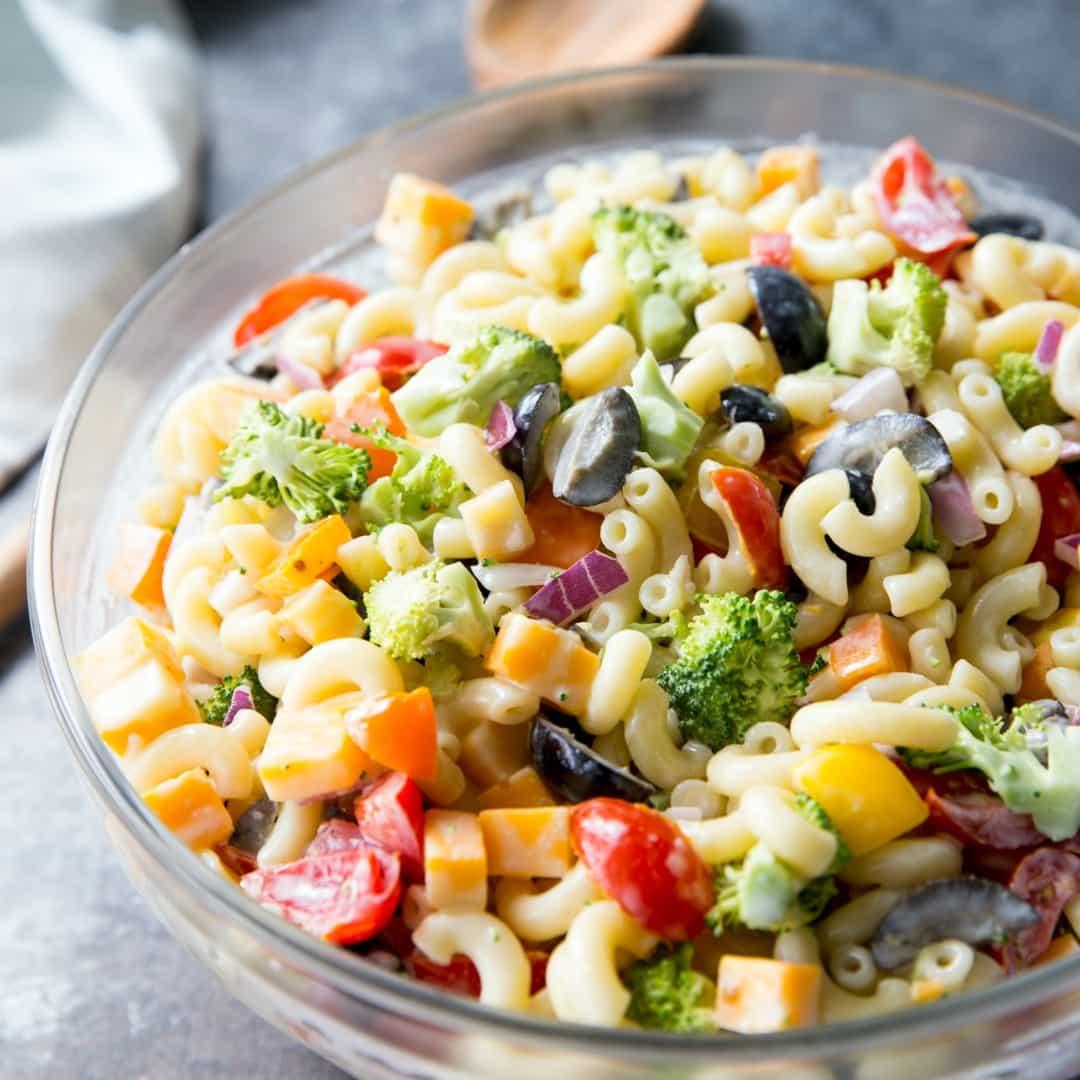 serving of rainbow veggie mac and cheese with a side salad