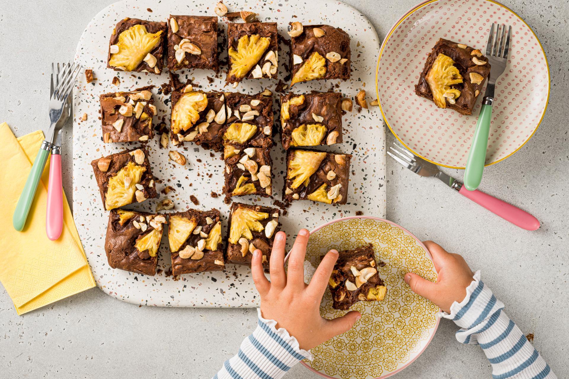 freshly baked pineapple brownies, golden brown and slightly gooey, with visible pineapple chunks