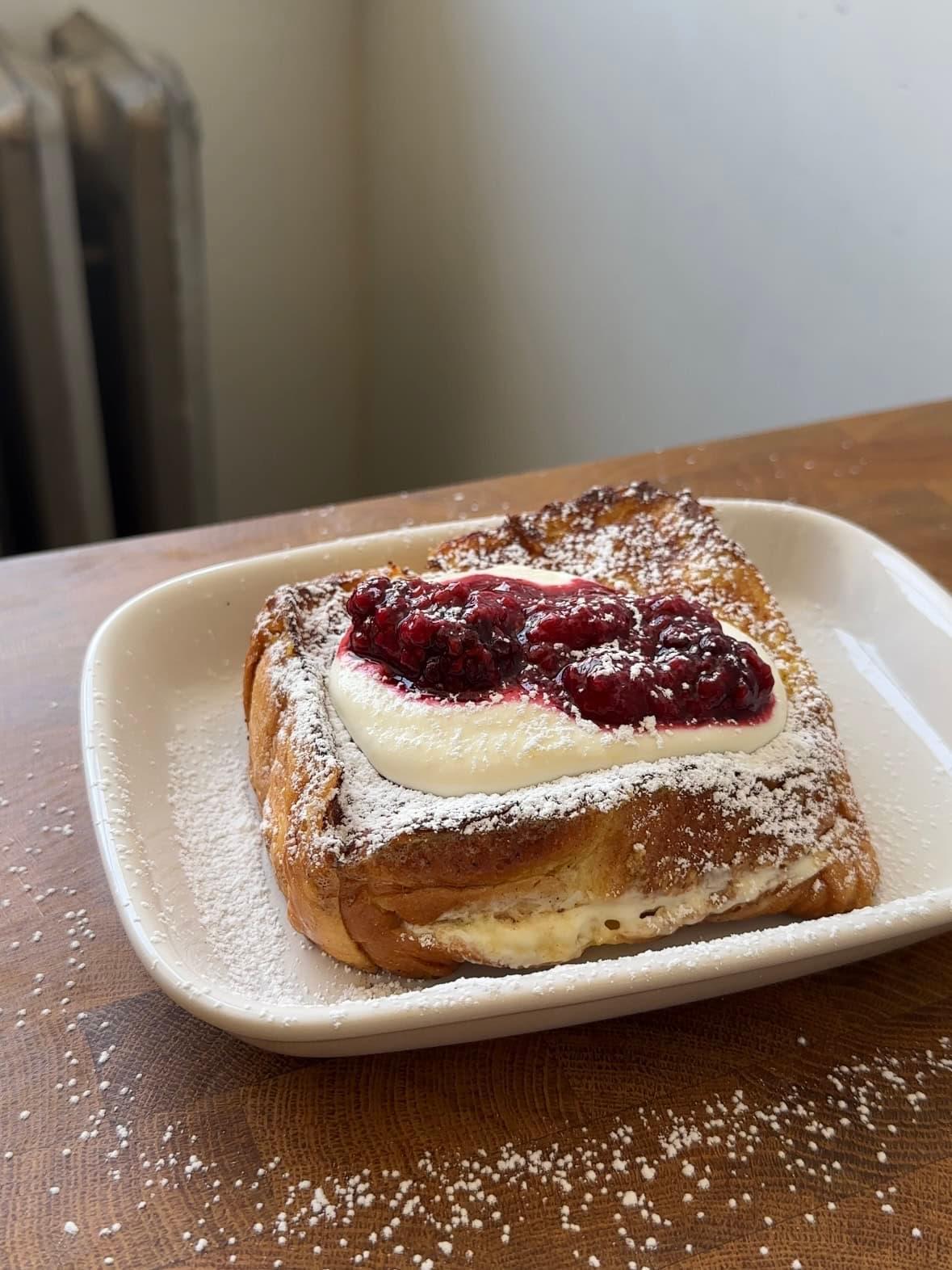 lemon ricotta french toast with poppy seeds on a plate