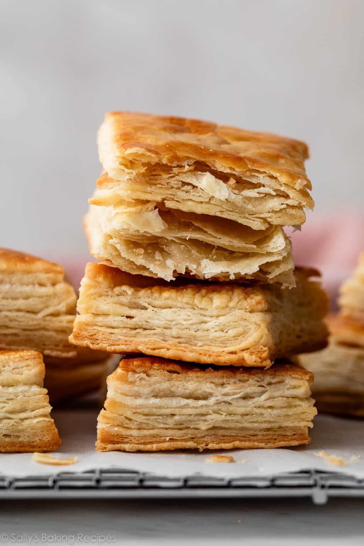 Golden brown, flaky pastry puffs on a baking sheet