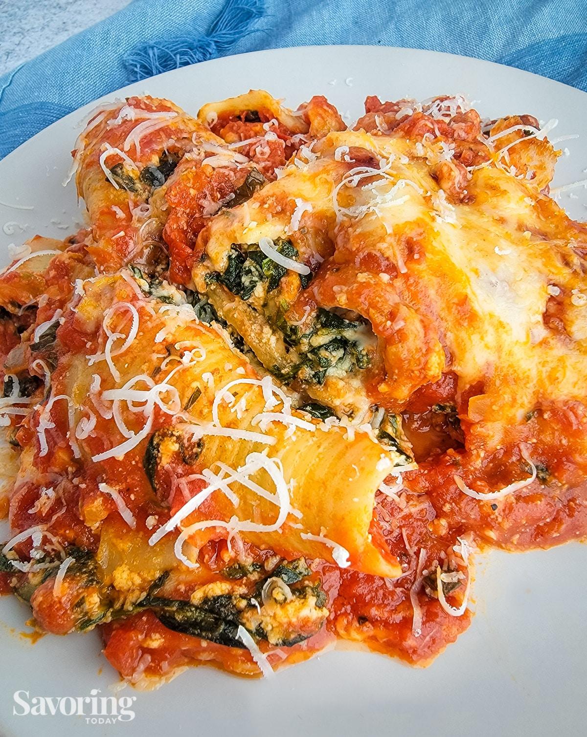 close-up of Spinach and Ricotta Stuffed Shells Casserole showing the cheesy topping and layers