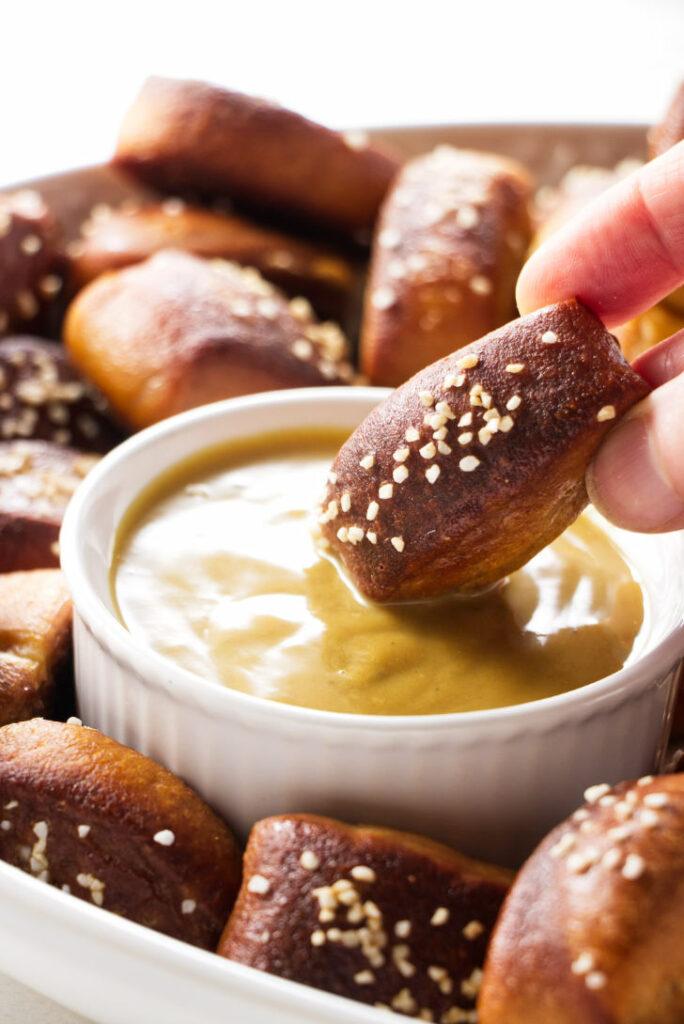 close up shot of beer pretzel bites drizzled with marmalade and chocolate