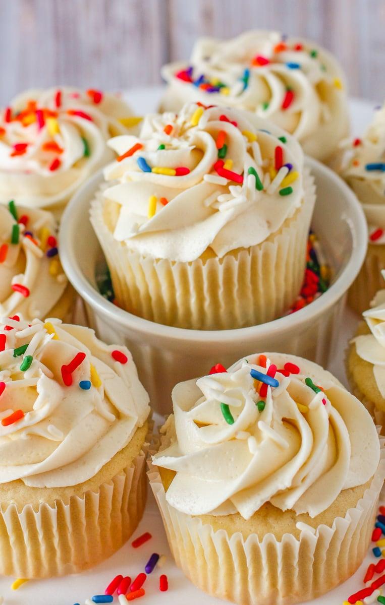 Close-up shot of Birthday Cake Batter Swirl Cupcakes with a sprinkle of colorful sprinkles