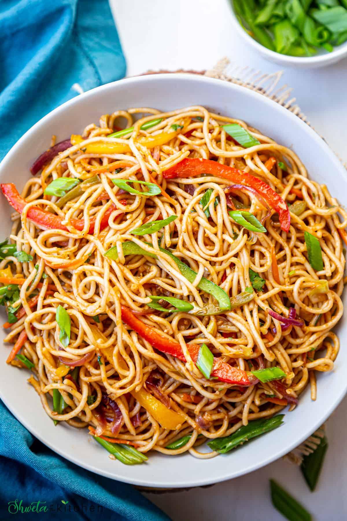 Close-up of various vegetables and noodles used in the recipe