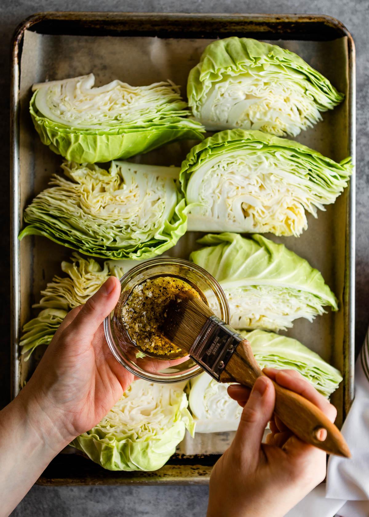 raw green cabbage cut into wedges, ready for roasting