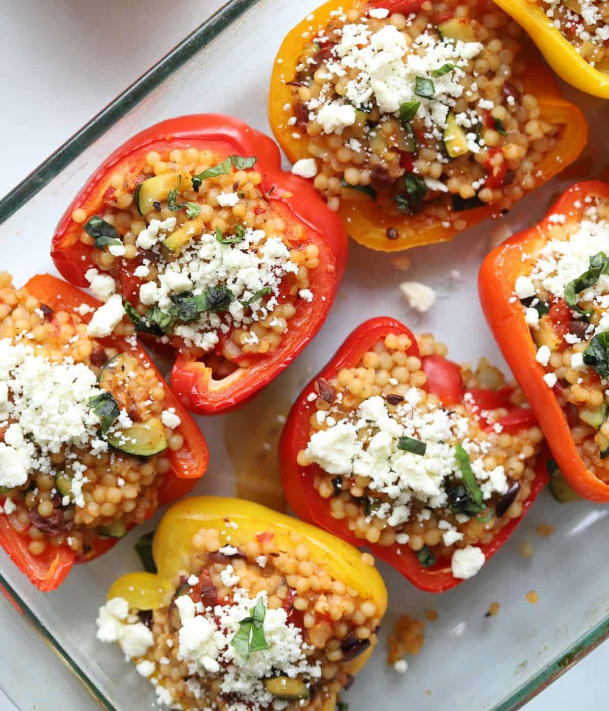 Close-up shot of Israeli couscous stuffed peppers with a dollop of yogurt
