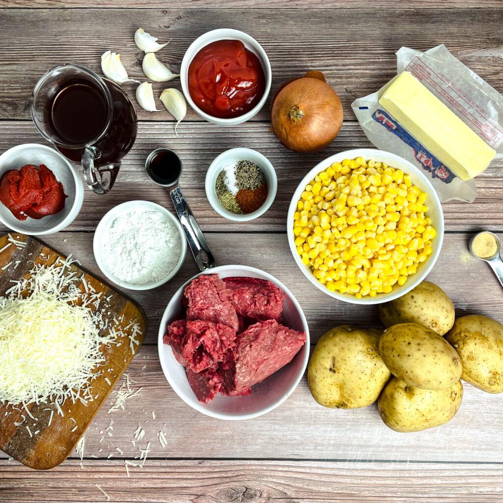 ingredients for shepherd's pie soup laid out on a wooden table