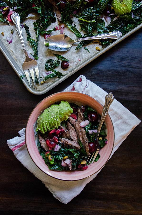 A group of friends enjoying the steak and kale salad outdoors