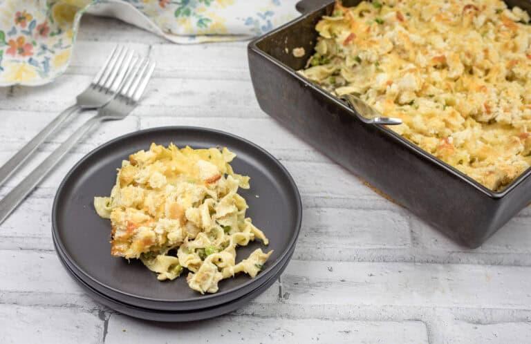 A family gathered around a table, enjoying a serving of tuna noodle casserole