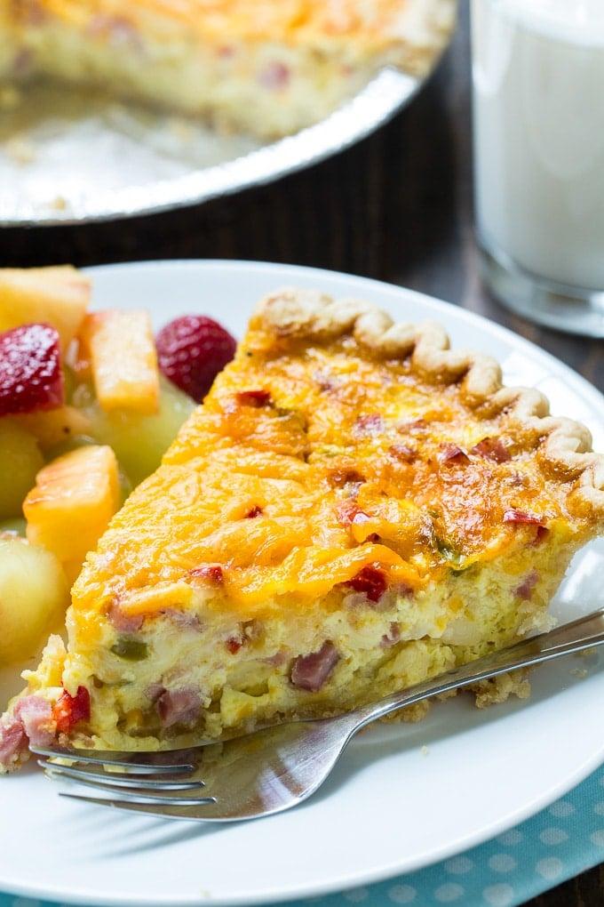 Close up of a slice of Denver Omelet Quiche showing the texture and ingredients