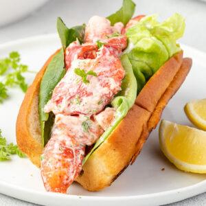 Close-up of the lobster tail and toast, showcasing the textures and colors