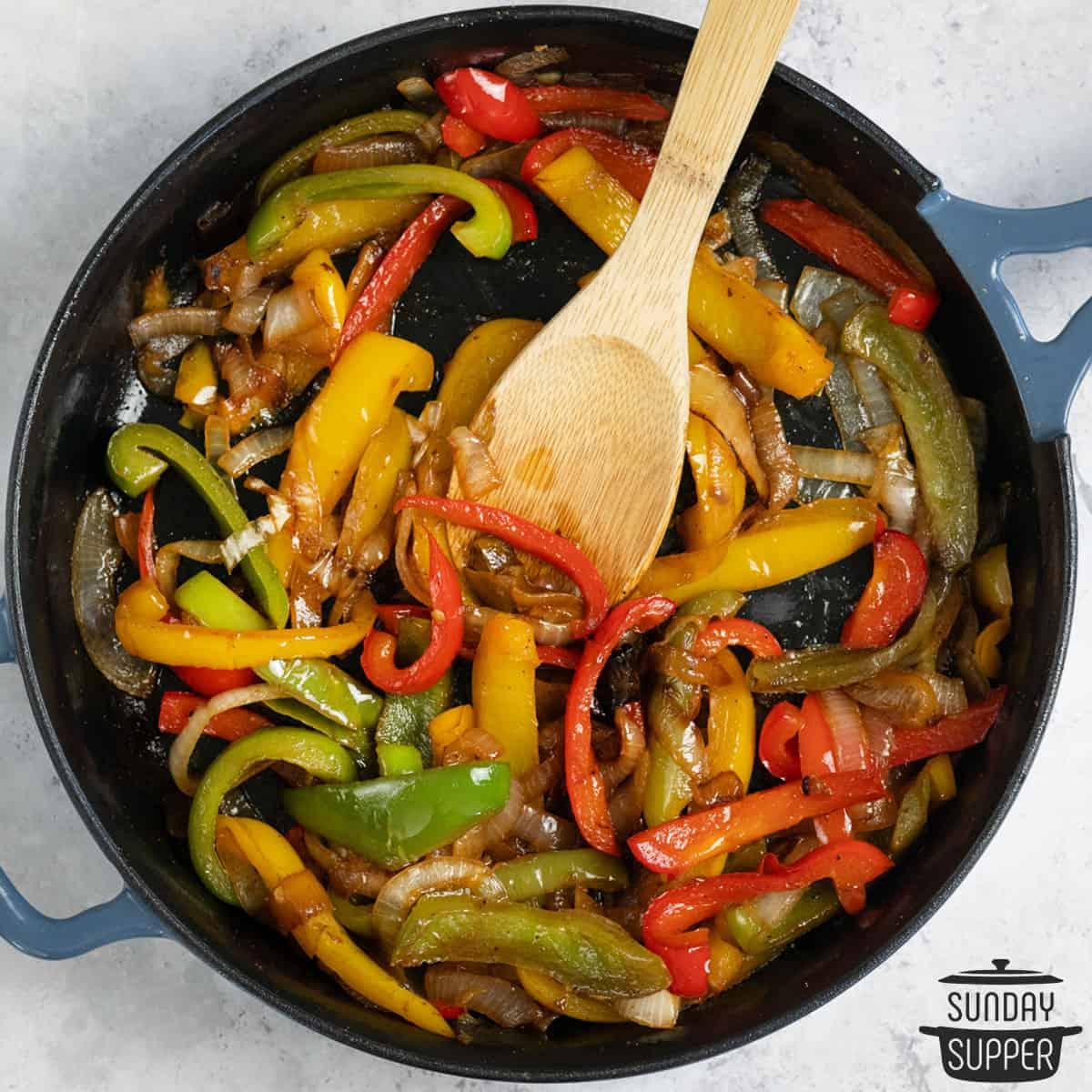 close-up of sautéed bell peppers in a skillet