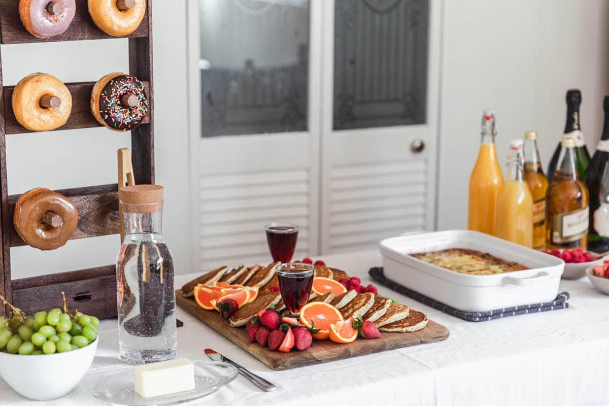 A table set for brunch, with the beer pretzel breakfast casserole as the centerpiece