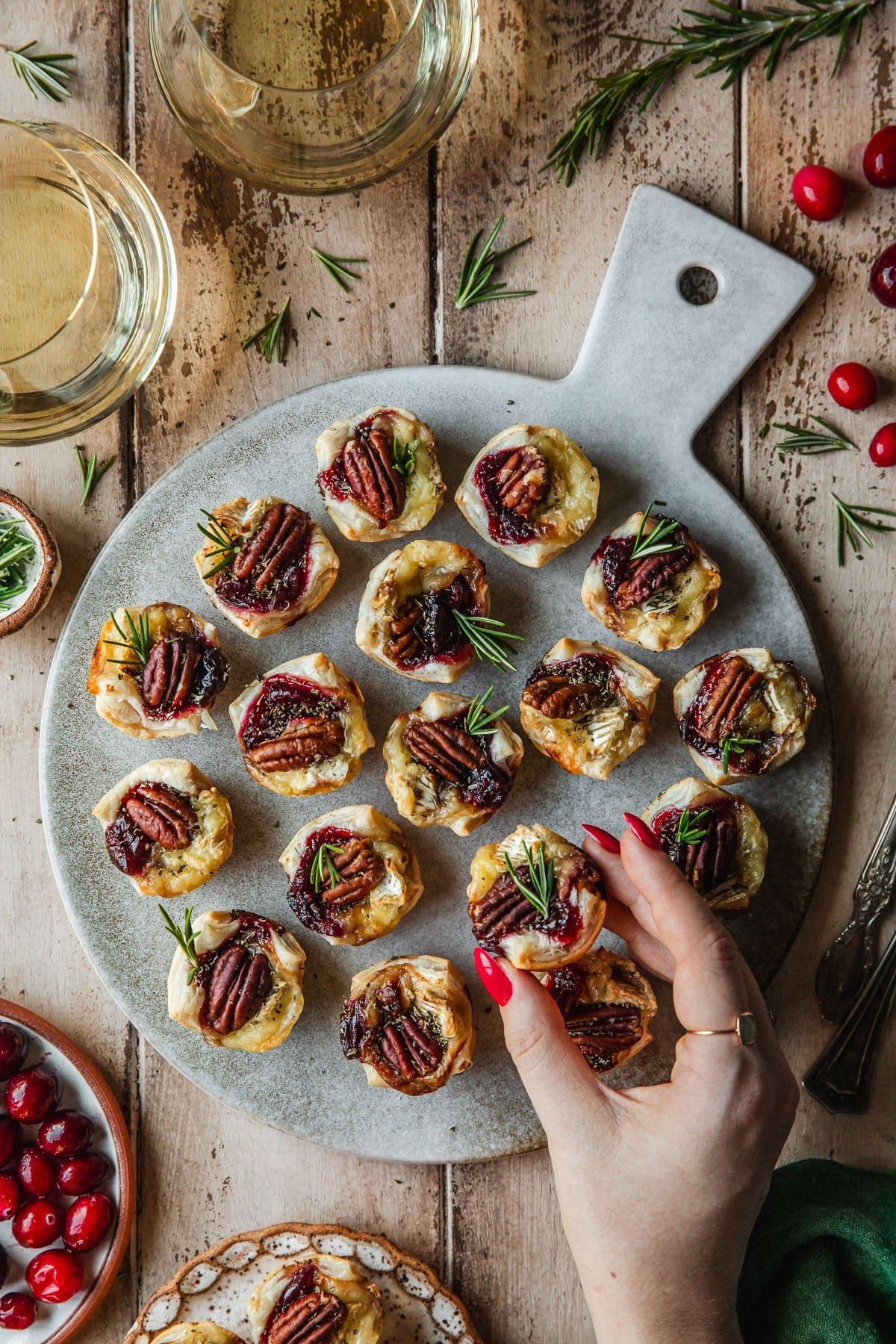 tray of cranberry brie bites on a festive table