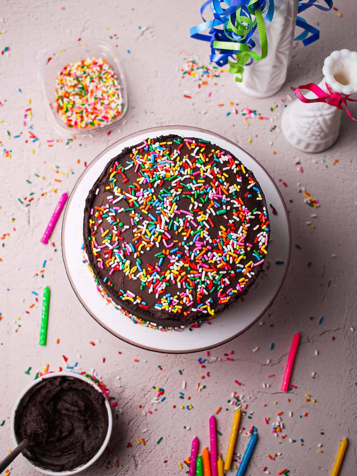 Overhead shot of a fully decorated birthday cake on a cake stand