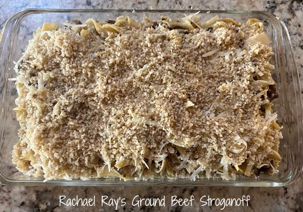 Close up of a golden brown Beef Stroganoff Casserole bubbling in a baking dish