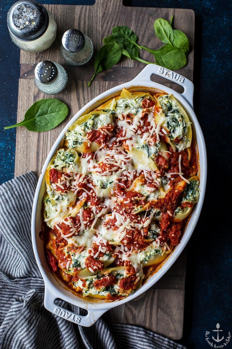 overhead shot of Spinach and Ricotta Stuffed Shells Casserole in a baking dish
