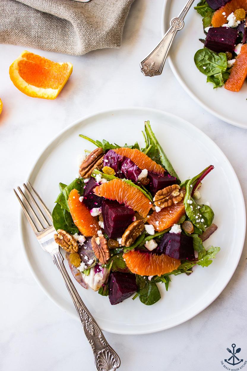 A beautiful, sunlit table setting with the chilled beetroot and orange salad as the centerpiece