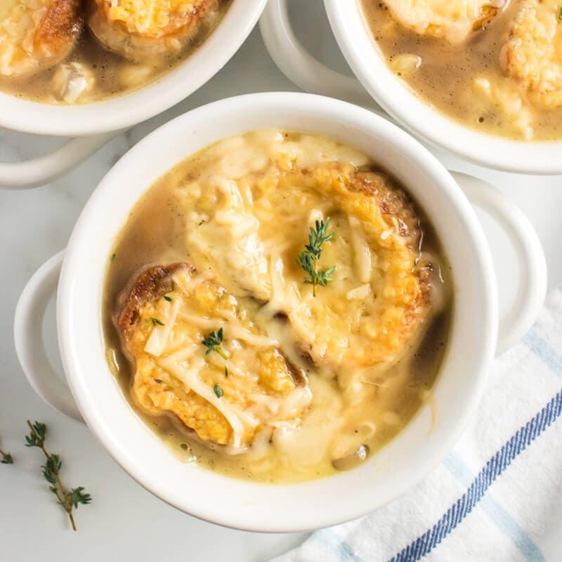 A rustic bowl of keto french onion soup with bubbling cheese