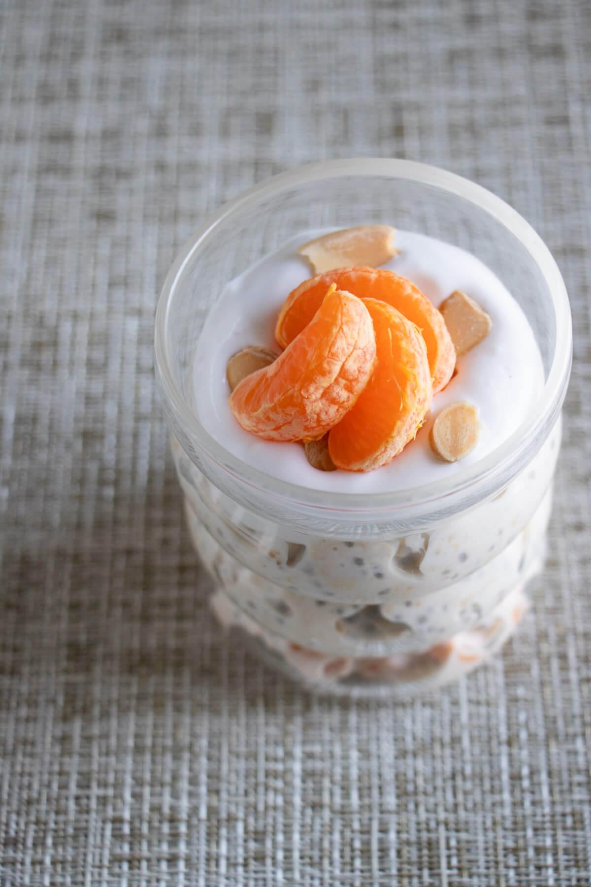 close-up shot of tangerine overnight oats in a glass jar