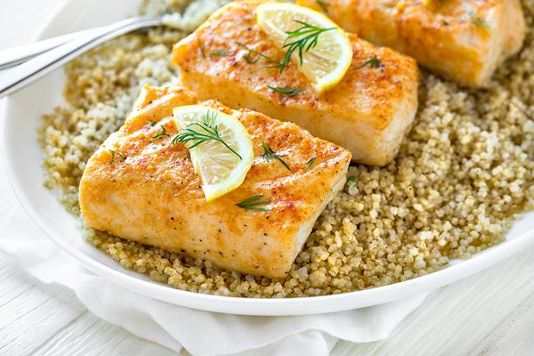 halibut fillets being prepared for baking