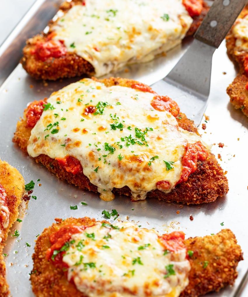 Crispy parmesan crusted fried chicken with marinara sauce