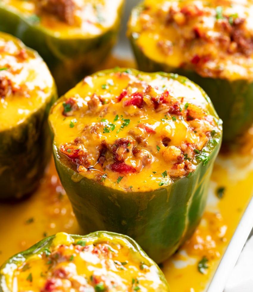 preparing bell peppers for stuffing in a kitchen