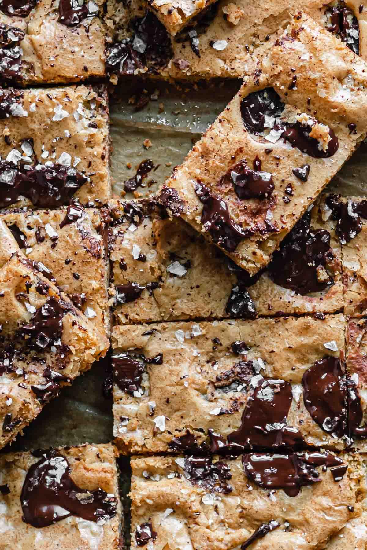 Close up shot of a pan of brownie brown butter blondies, showing the texture and ingredients