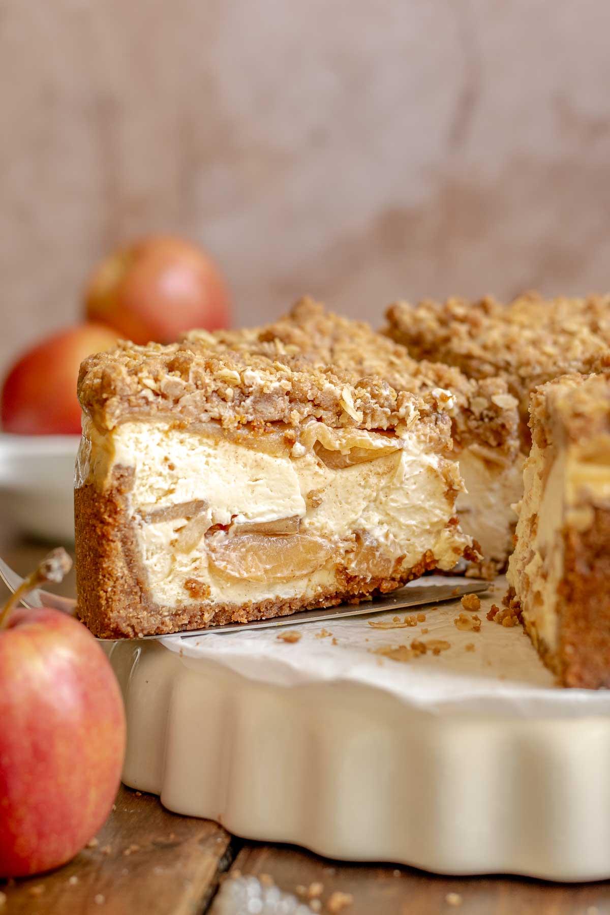 A close-up shot of a half-baked apple pie cheesecake bite showing the layers