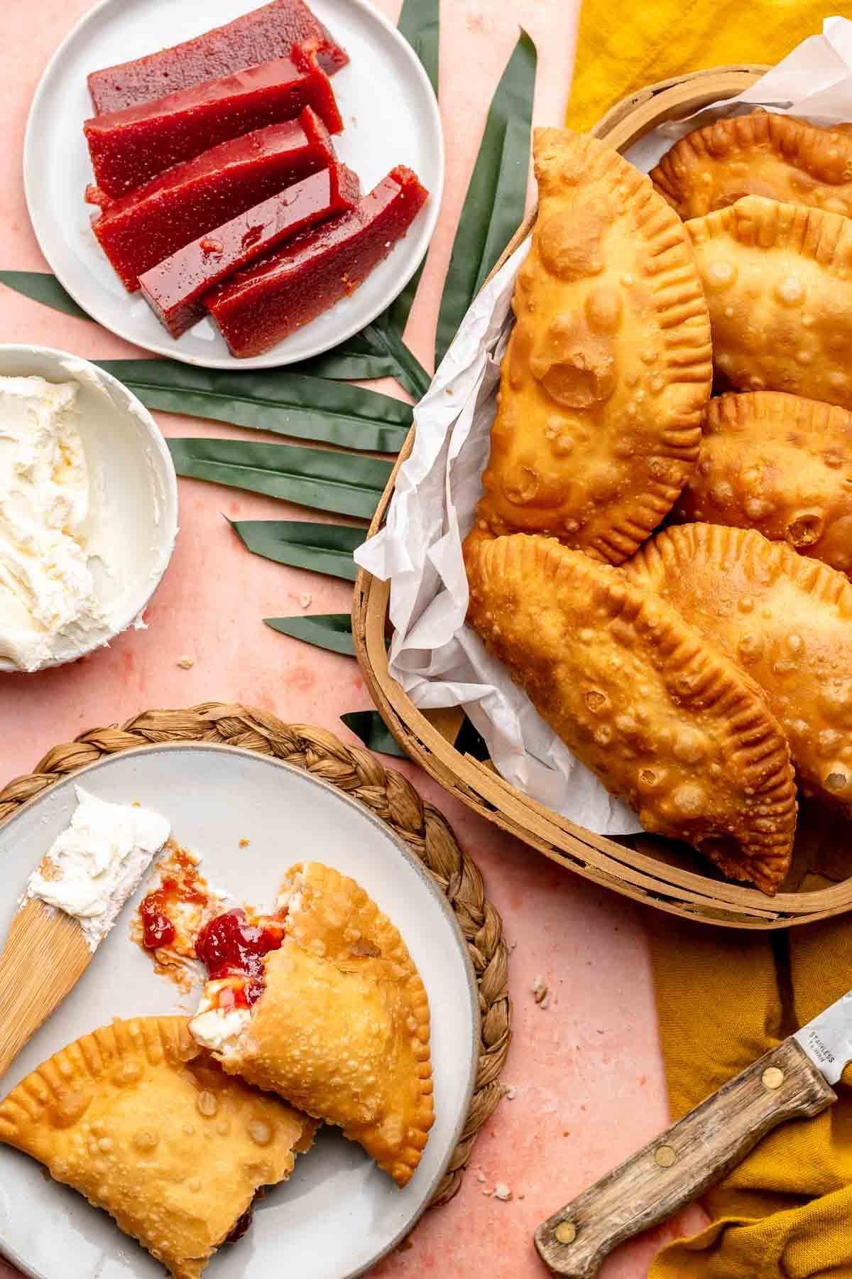 A plate of freshly baked guava and cheese empanadas, ready to be served
