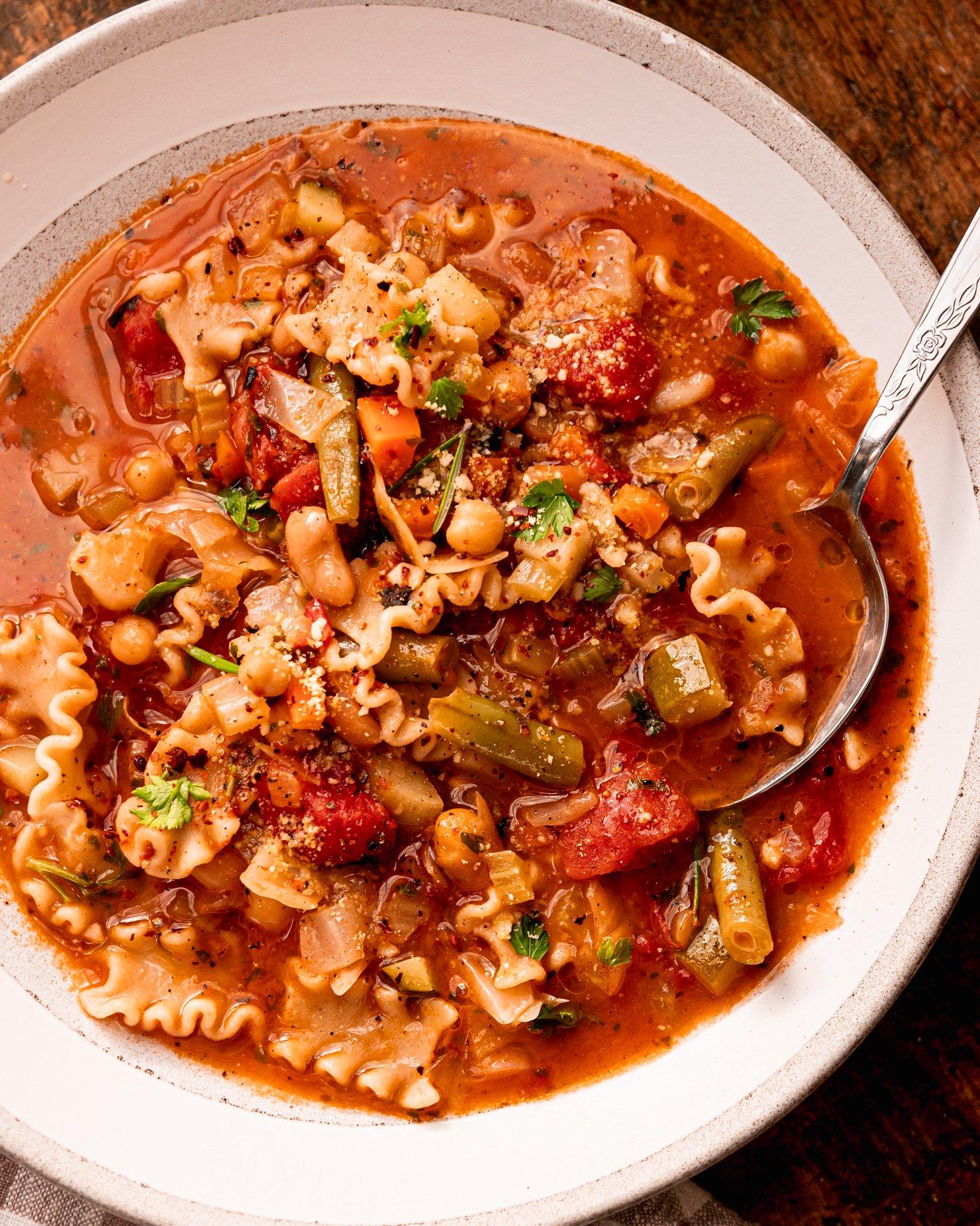 A family enjoying a bowl of vegan minestrone soup together