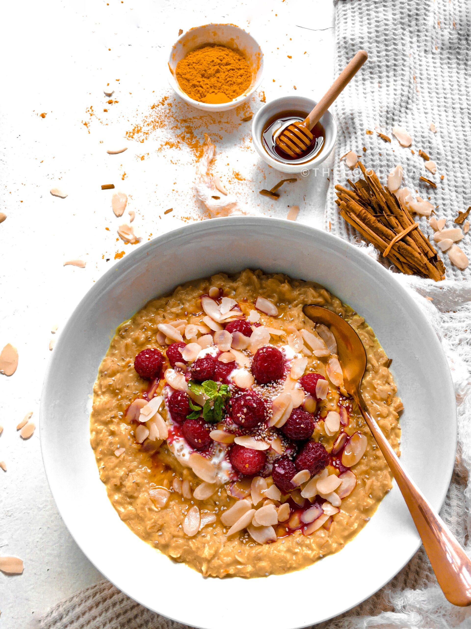 close-up shot of a spoonful of tropical turmeric oatmeal with visible turmeric powder