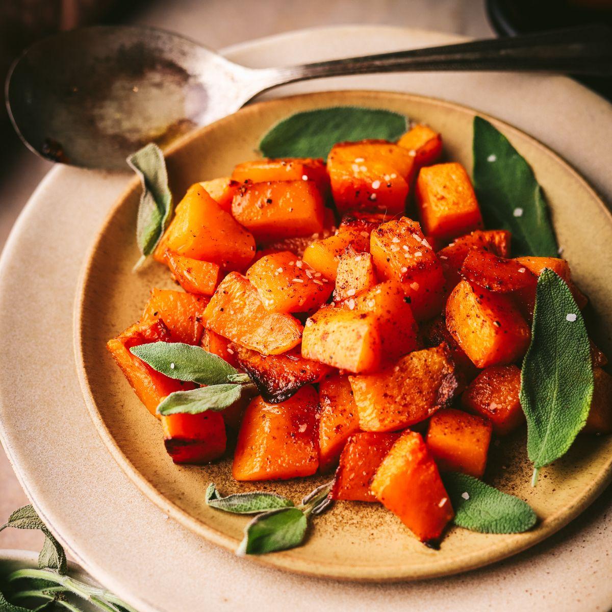A beautifully plated dish of butternut squash with maple-cinnamon glaze