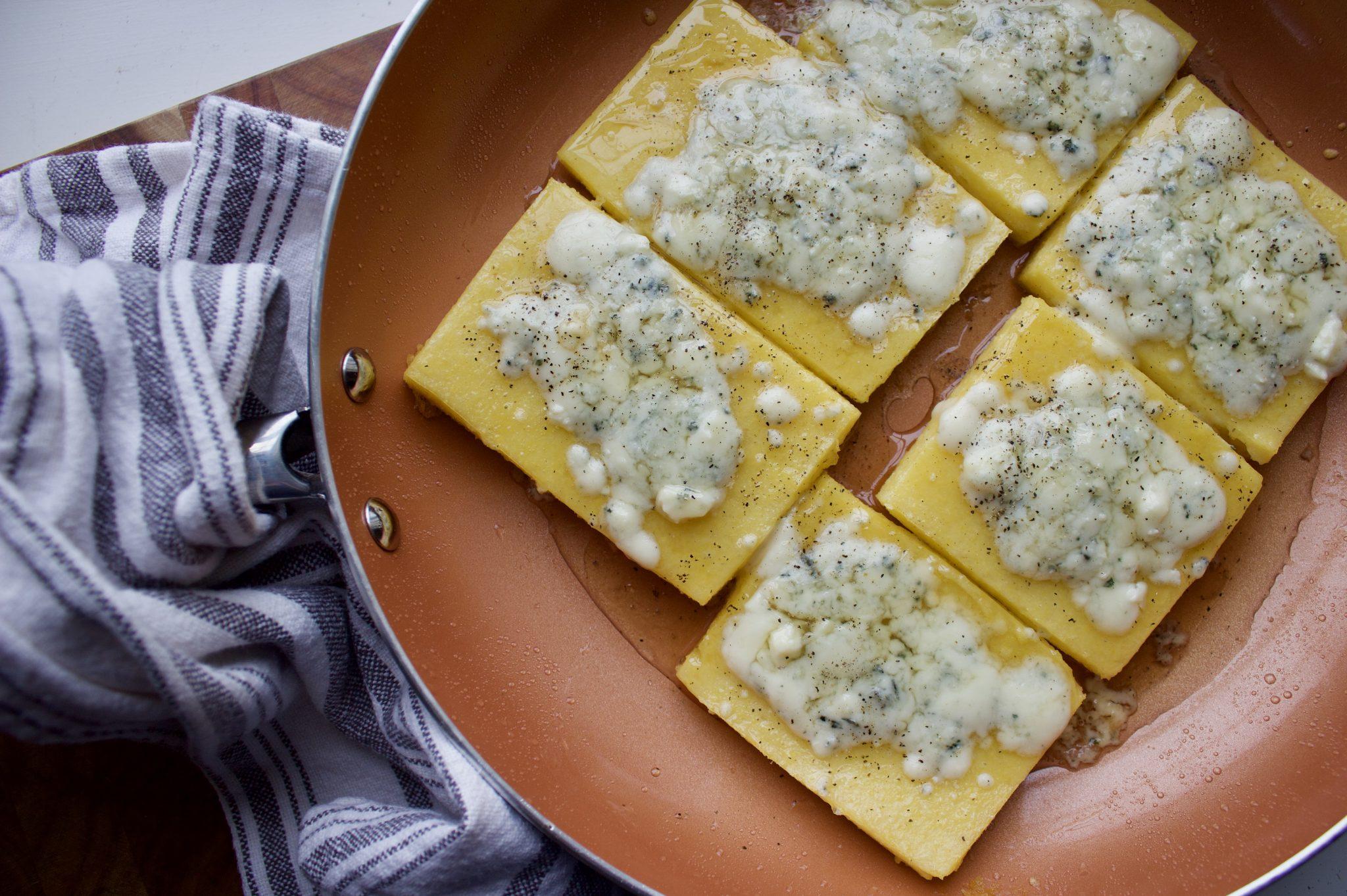 Close-up of the ingredients: polenta, gorgonzola cheese, walnuts, parmesan cheese, honey
